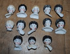 13 antique German small china doll heads, painted 0402