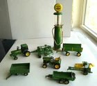Mixed 1/64 Farm Tractor, Gas Pump and Implements Lot Mostly Ertl John Deere