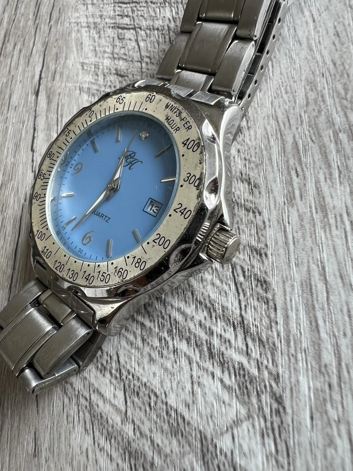 Reloj unisex Paris Hilton de cuarzo plateado con esfera azul correa de acero Foto 3 de 4
