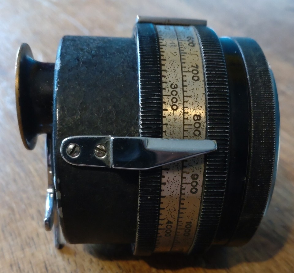 A clockwork stroboscope tachometer — a mechanical spinning-light instrument from before electronics existed that measures rotation speed purely through gears and optics.