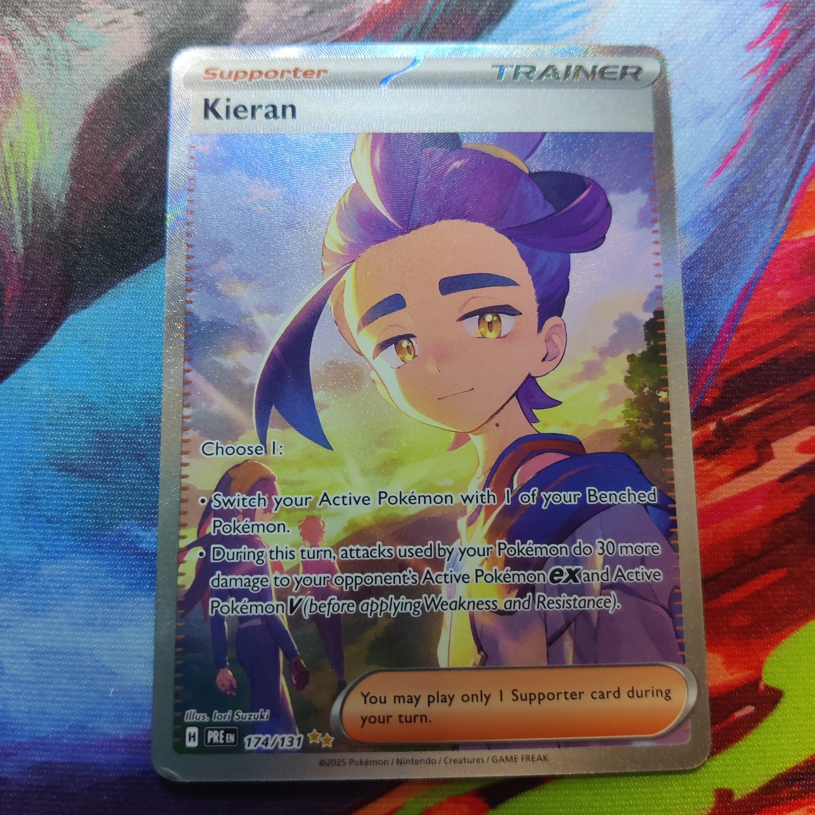 Kieran 174/131 – Prismatic Evolutions – Ultra Rare Trainer – LP (Surface Bubble)