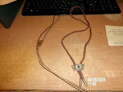 2 BOLOS TIES FOR SALE 1 HAS  LETTER ''R'' AND  1 WESTERN THEME