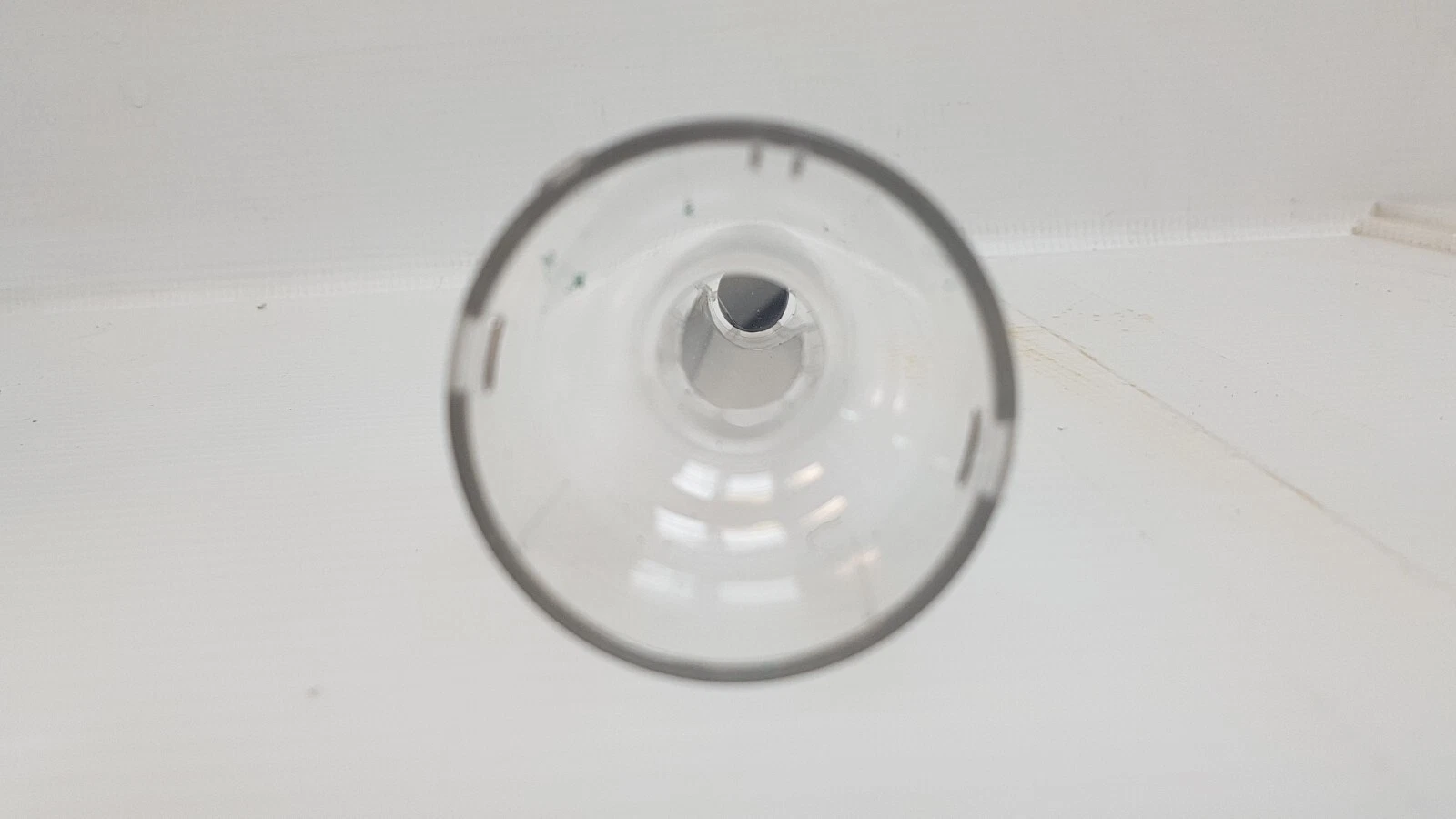 Looking into the cup-shaped base of a clear Lumenis tip
