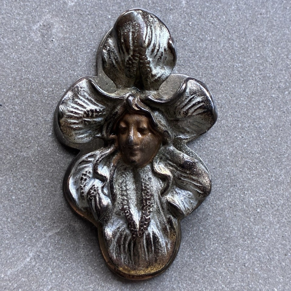 H.L. Judd Art Nouveau iris-and-woman letter clip — a named antique manufacturer piece that's as much jewelry as it is a desk tool.