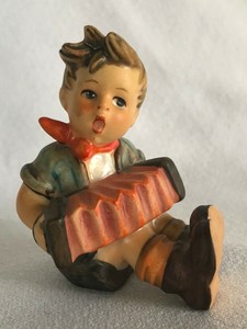 hummel boy playing accordion