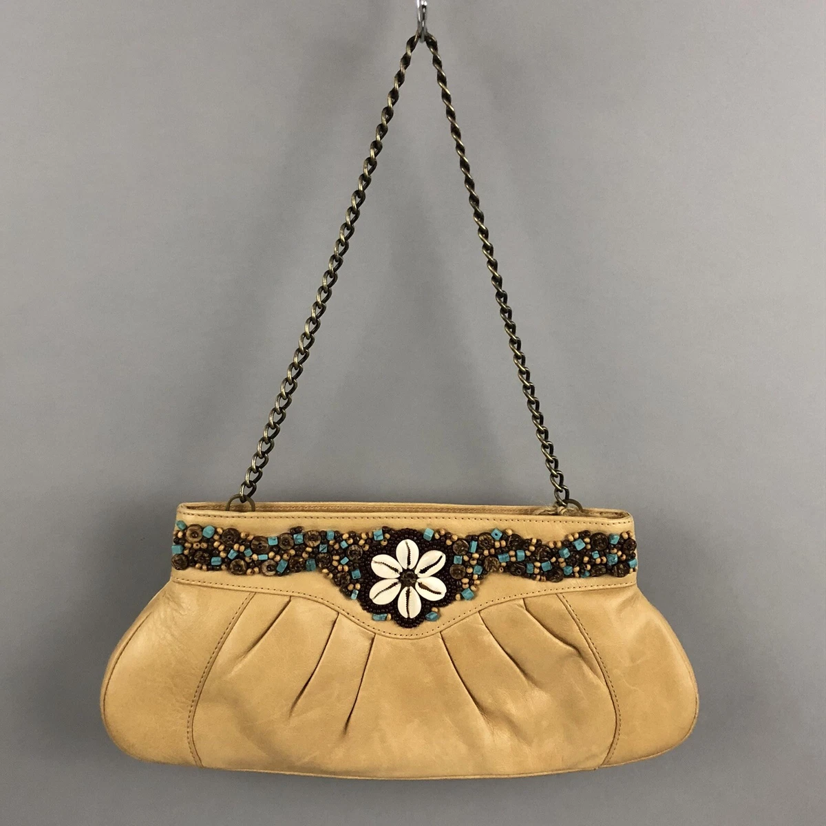 Handbag with shells on strap sales