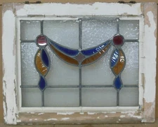 A SWAG IN AN OLD ENGLISH LEADED STAINED GLASS WINDOW 20" X 16"