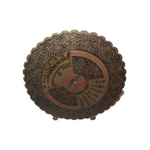 A fully mechanical perpetual calendar from 1899–1948 in ornate antique brass — a functional artifact that predates digital everything.