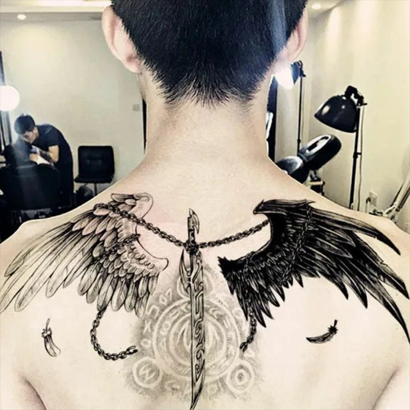 fallen angel wings tattoo