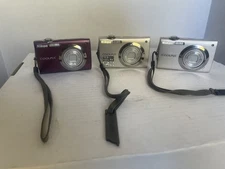 2 Nikon Coolpix S4000 and 1 Nikon coolpix 3000 and 2 SD cards  parts or Repair