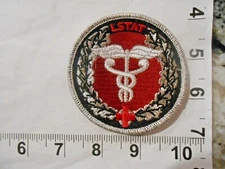 LSTAT LIFE SUPPORT FOR TRAUMA TRANSPORT RED CROSS MEDICAL PATCH