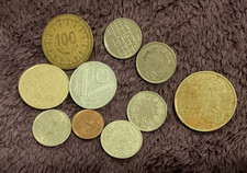 Assorted worn foreign coins