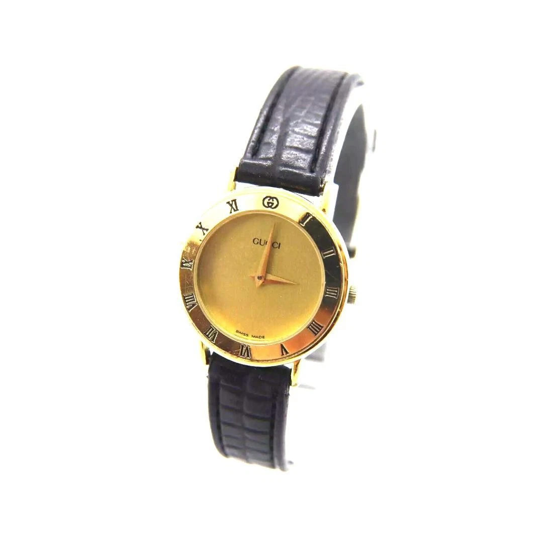 Montre Gucci 30002L vintage femme 25 mm or quartz ronde fabrication suisse boîte