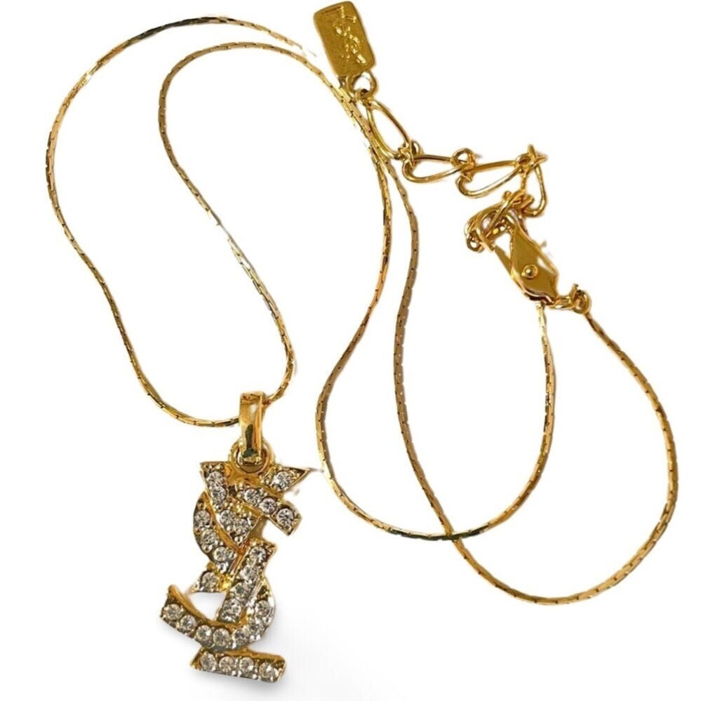 Vintage Yves Saint Laurent golden YSL logo necklace with
