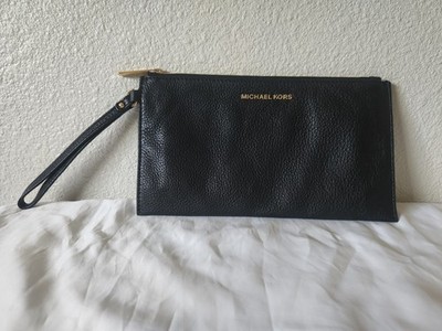 michael kors black clutch purse medium with gold accents.  Excellent condition.