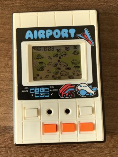 Liwaco Electronic LCD Game & Watch 1983 Airport (A) - Afbeelding 1 van 4