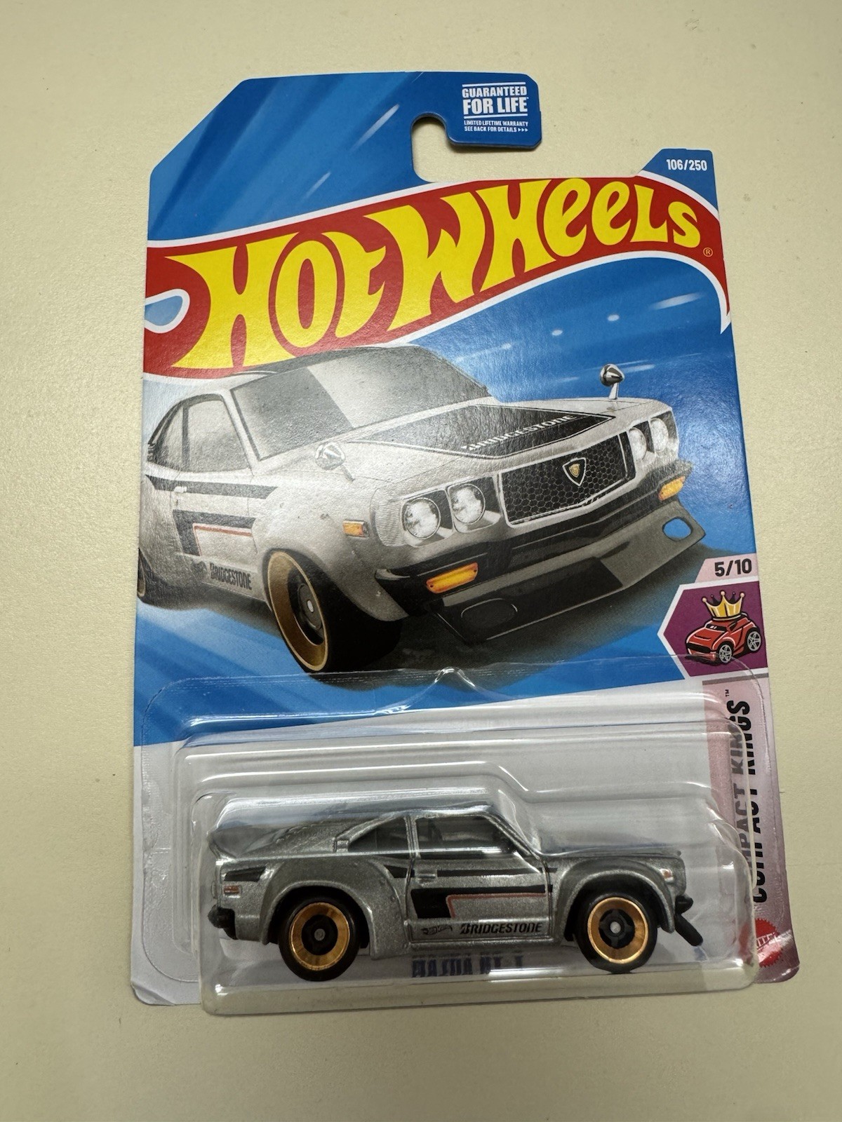 2026 Hot Wheels From E Case Mazda RX-3 Gray in hand