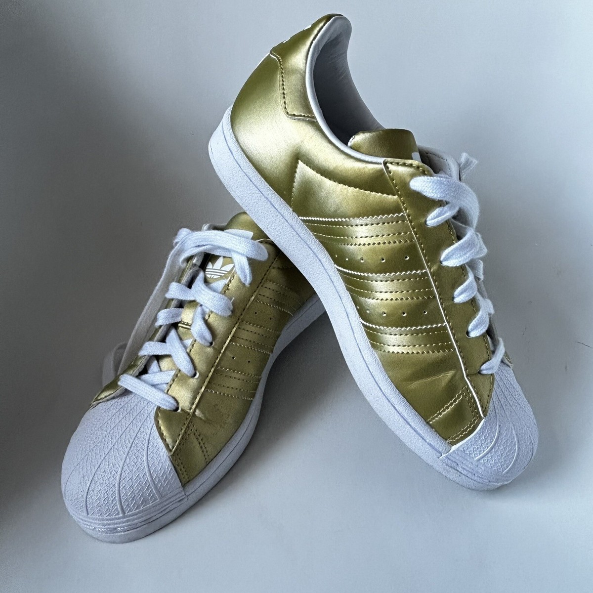 adidas super star dorados