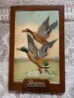 VINTAGE RAINIER AGED MALLARD DUCKS BEER & ALE SIGN COMPOSITION FIBER BOARD