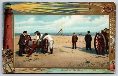 Lighthouse Shines Over Oblong Inset Of Beach Scene  Loading The Gun ~c1910