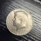 1776-1976 BICENTENNIAL HALF DOLLAR(STRUCK ON BAD PLANCHET AND HAS A SMOOTH EDGE)