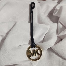 Brand New Michael Kors MK black leather gold tone bag charm w/ black leather.