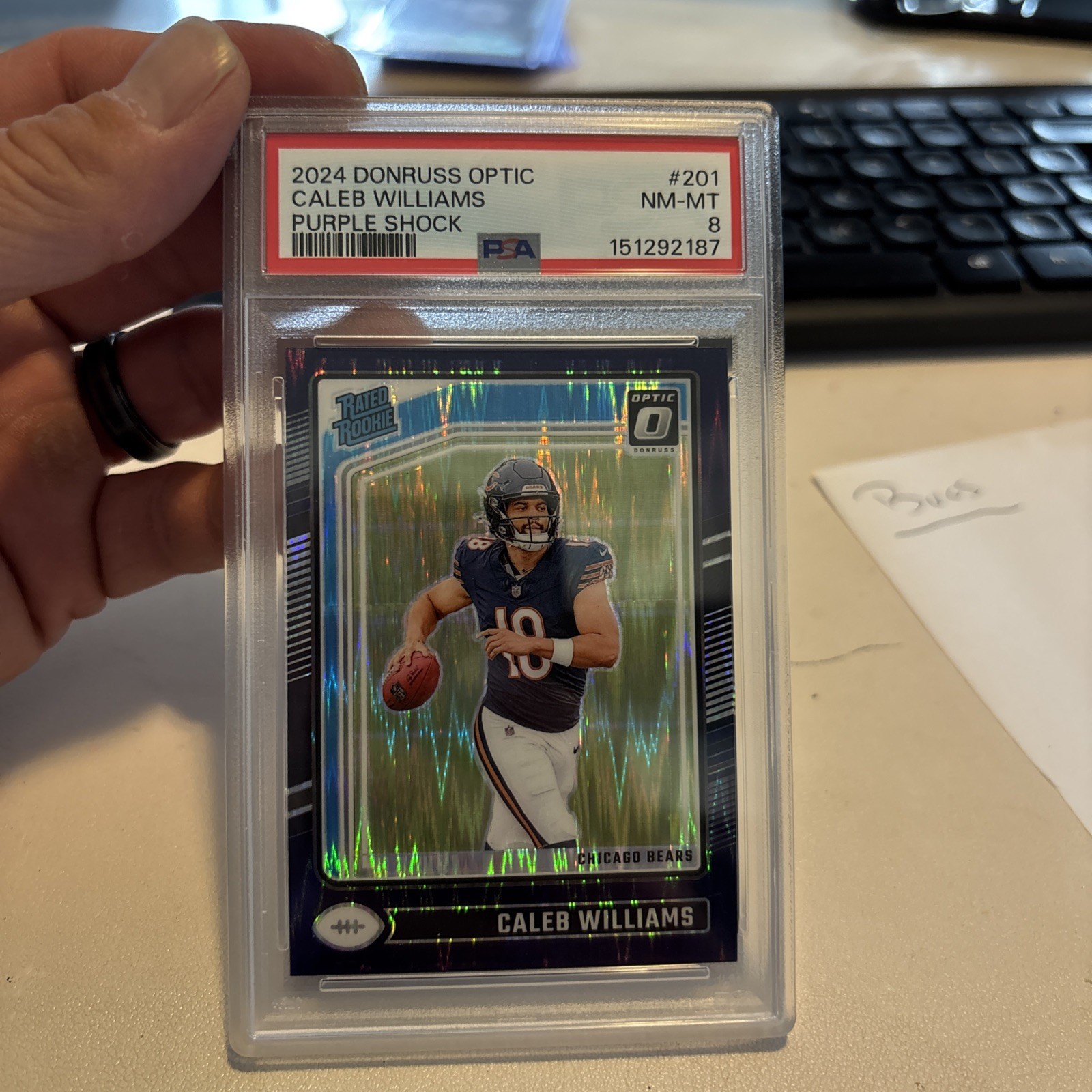 2024 Donruss Optic - Rated Rookie Caleb Williams #201 Purple Shock Prizm PSA 8