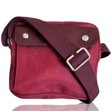 Longchamp Le Pliage-style crossbody bag in a red/burgundy nylon and leather.