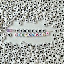 7MM White Flat Round Acrylic with Black Star Beads