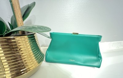 DeMellier London Cannes clutch bag in a green smooth leather