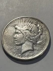 1923 D E/FINE AU US Peace Silver Dollar       N603