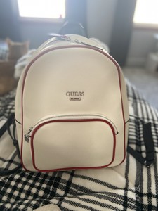 red backpack with white straps