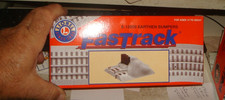 LIONEL FASTRACK. EARTHEN BUMPERS. BRAND NEW. 6-12059