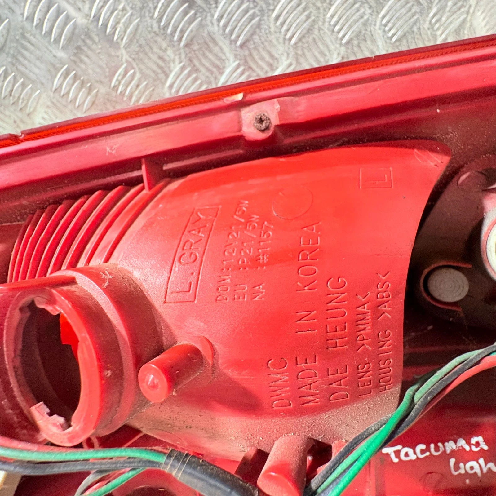 Moulded markings on Daewoo Tacuma Chevrolet Rezzo rear lamp PMMA ABS made in Korea