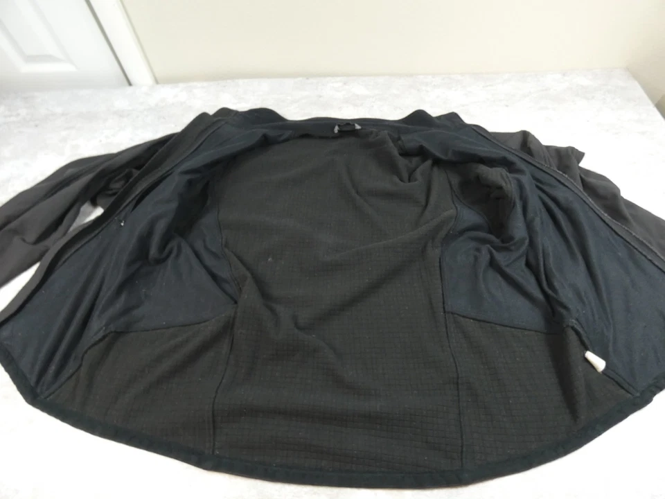 Chaqueta cortavientos de nailon cremallera completa polar negra XL Marmot para hombre abrigo cuello falso Foto 3 de 4