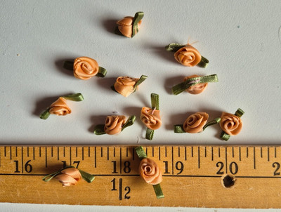 SMALL CURRY  SATIN RIBBON ROSETTES ON GREEN  7/8  INCHES   24  PIECES