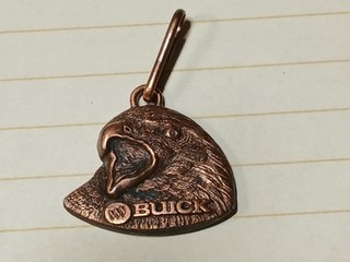 “Vintage USA‑made Buick dealership promotional key tag copper‑washed cast metal