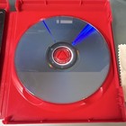 Red Mortal Kombat Komplete Edition disc with blue spine, white label, and visible WB Games logo on white plastic case.