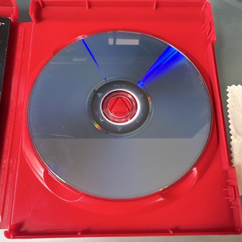 Red Mortal Kombat Komplete Edition disc with blue spine, white label, and visible WB Games logo on white plastic case.