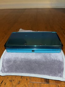 Nintendo 3DS Aqua Blue System w/ Pokemon Alpha Sapphire TESTED 64GB SD + Charger
