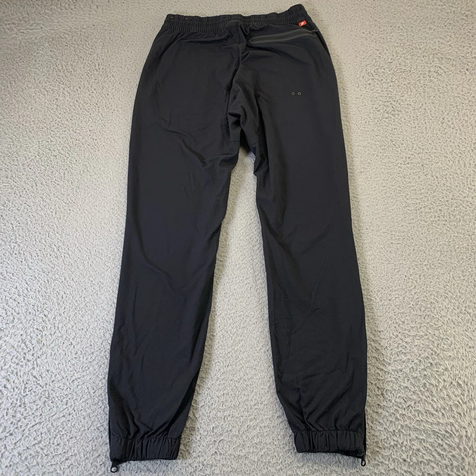 Pantalones Nike Sportswear V442 para hombre medianos negros botones a presión cordón 30" entrepierna Foto 3 de 4