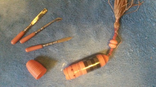 3 1/4" German orange cylinder with tassle holding (3) Nail Implements