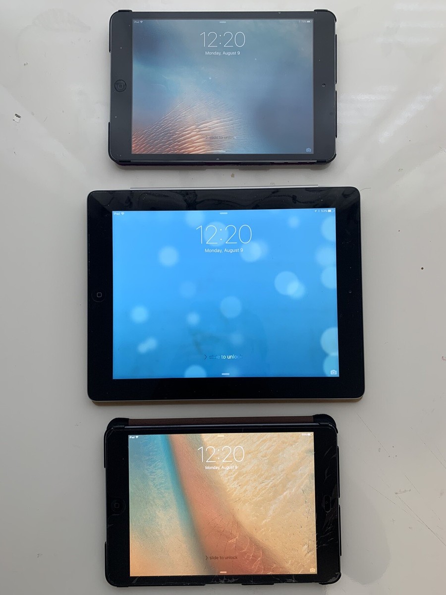 Apple iPad Lot With 2 Apple iPad Minis And 1 Apple iPad With Cases