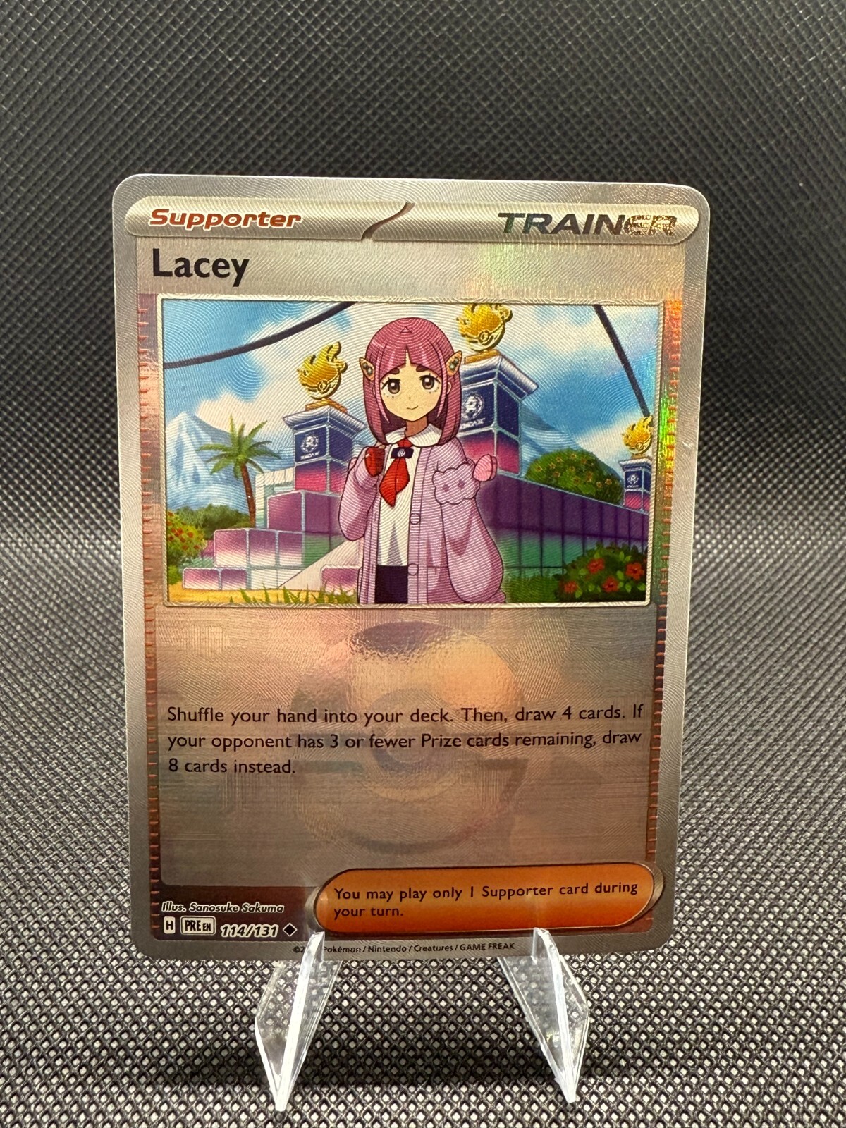 Lacey | 114/131 | Pokemon | Prismatic Evolutions | Poke Ball | 50% off 2nd Card