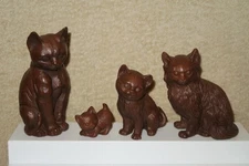 Four Vintage Red Mill Mfg. crushed pecan shell handcrafted resin cat figurines