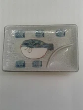 FISH ASHTRAY-CERAMIC-MULTI-COLORED ON LIGHT GRAY-TEXTURED BACKGROUND 