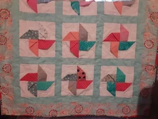 NEW HANDMADE BABY GIRL FLOPPY PINWHEEL QUILT. PROFESSIONALLY QUILTED