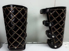 HAND TOOLED CARVED LEATHER VIKING GAUNTLET. FOLK BLACK (MDLG0131).. IN THE WOODS