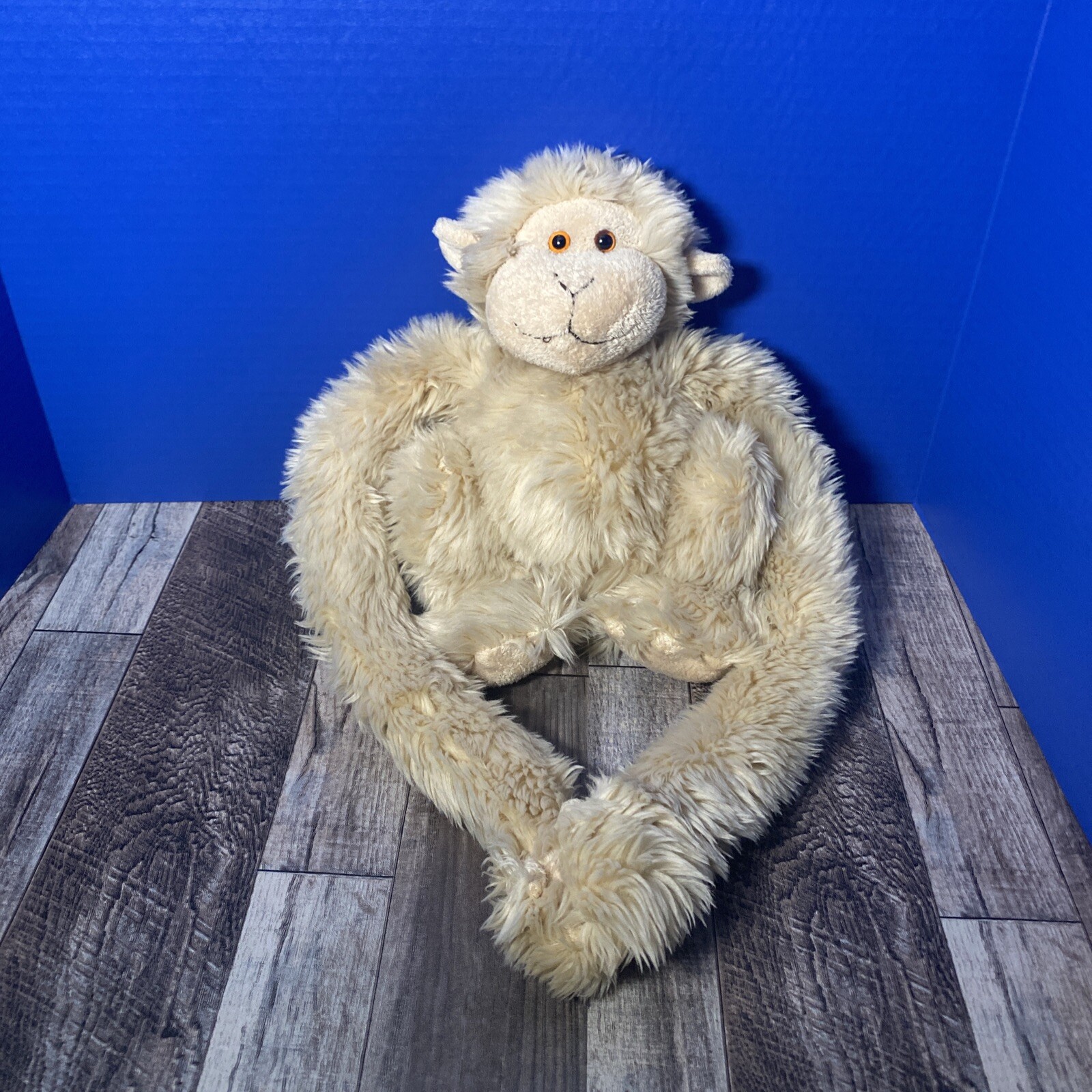 stuffed animal with long arms