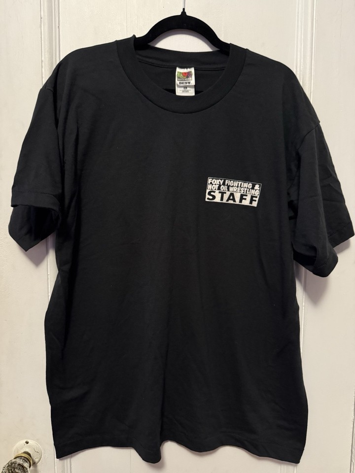 A genuine Y2K-era novelty tee for a 'Hot Oil Wrestling' staff event — the kind of unhinged vintage graphic shirt that stops people mid-sentence.